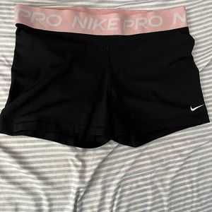 Nike pros with pink band
